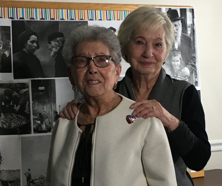 Sisters Anne Levy, left, and Lila Millen survived the Holocaust as hidden children in a wooden cabinet their father made. Sisters Anne Levy, left, and Lila Millen survived the Holocaust as hidden children in a wooden cabinet their father made.